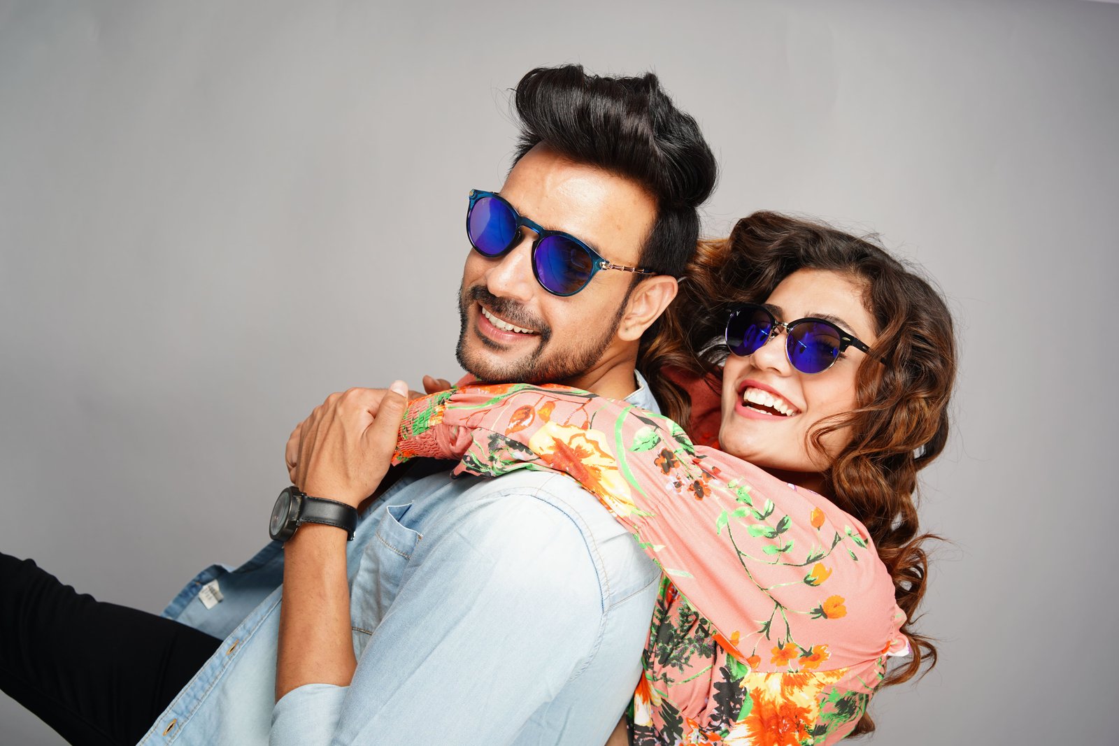 Sunglasses wearing a golden saree shot with softbox lighting